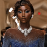 Anok Yai net worth 2026 — supermodel walking a luxury fashion runway show