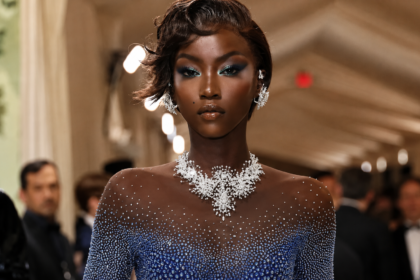 Anok Yai net worth 2026 — supermodel walking a luxury fashion runway show